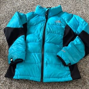 The North Face Blue and Black Puffer Jacket with Quilted Design